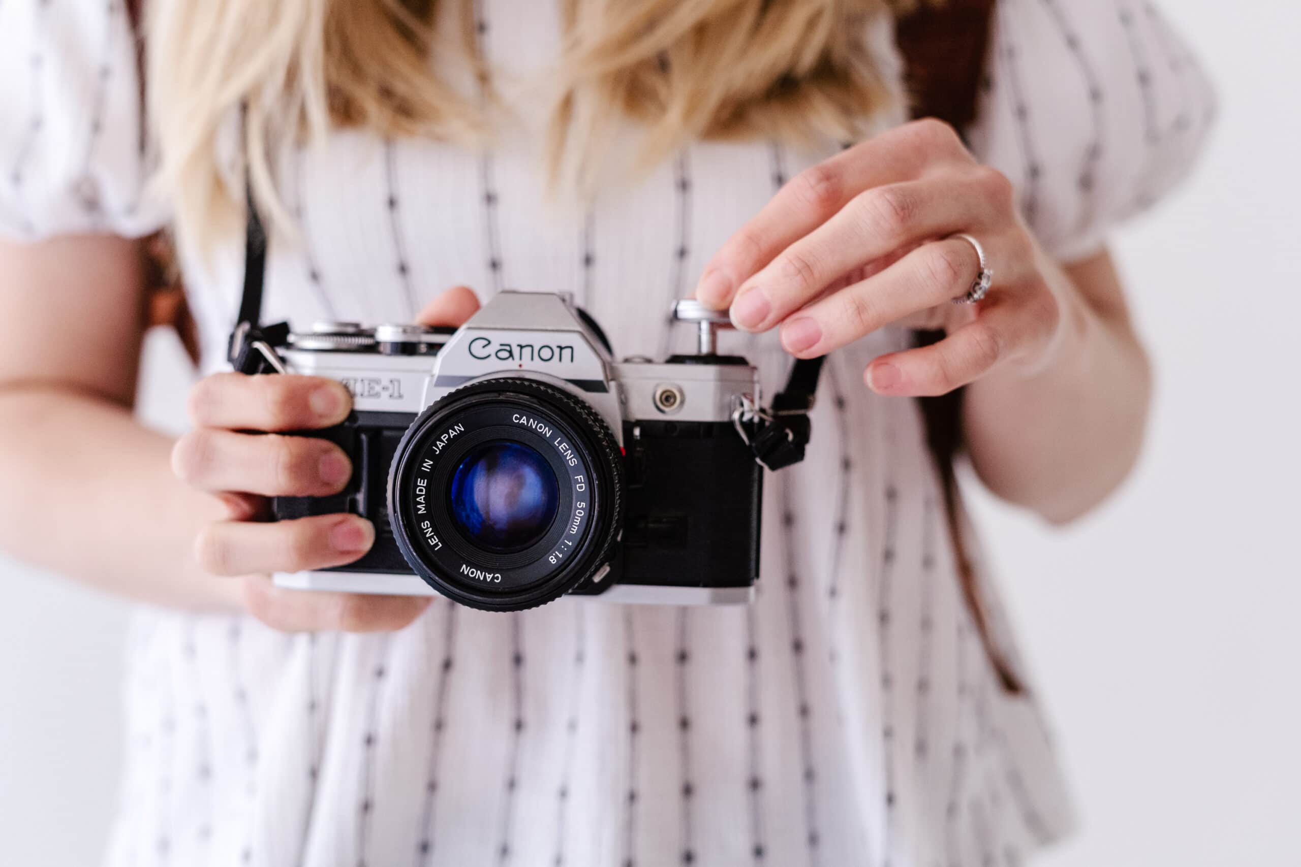 person holding a Canon camera